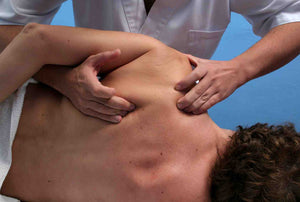 deep tissue massage of shoulder